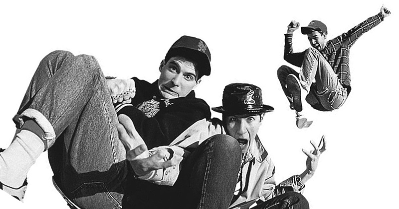 image of the beastie boys jumping behind a boombox taken from the ground's perspective looking up